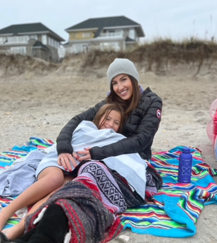 Shana with daughter at the beach