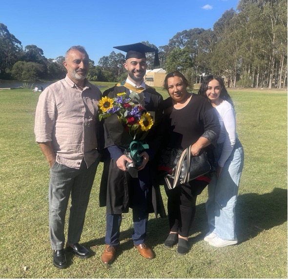 Zoheb and his family celebrating his graduation