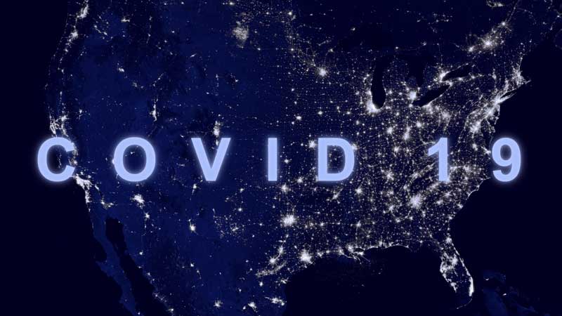 COVID-19 coronavirus in USA, name COVID on map of America. World economy hit by corona virus outbreak in US and pandemic.